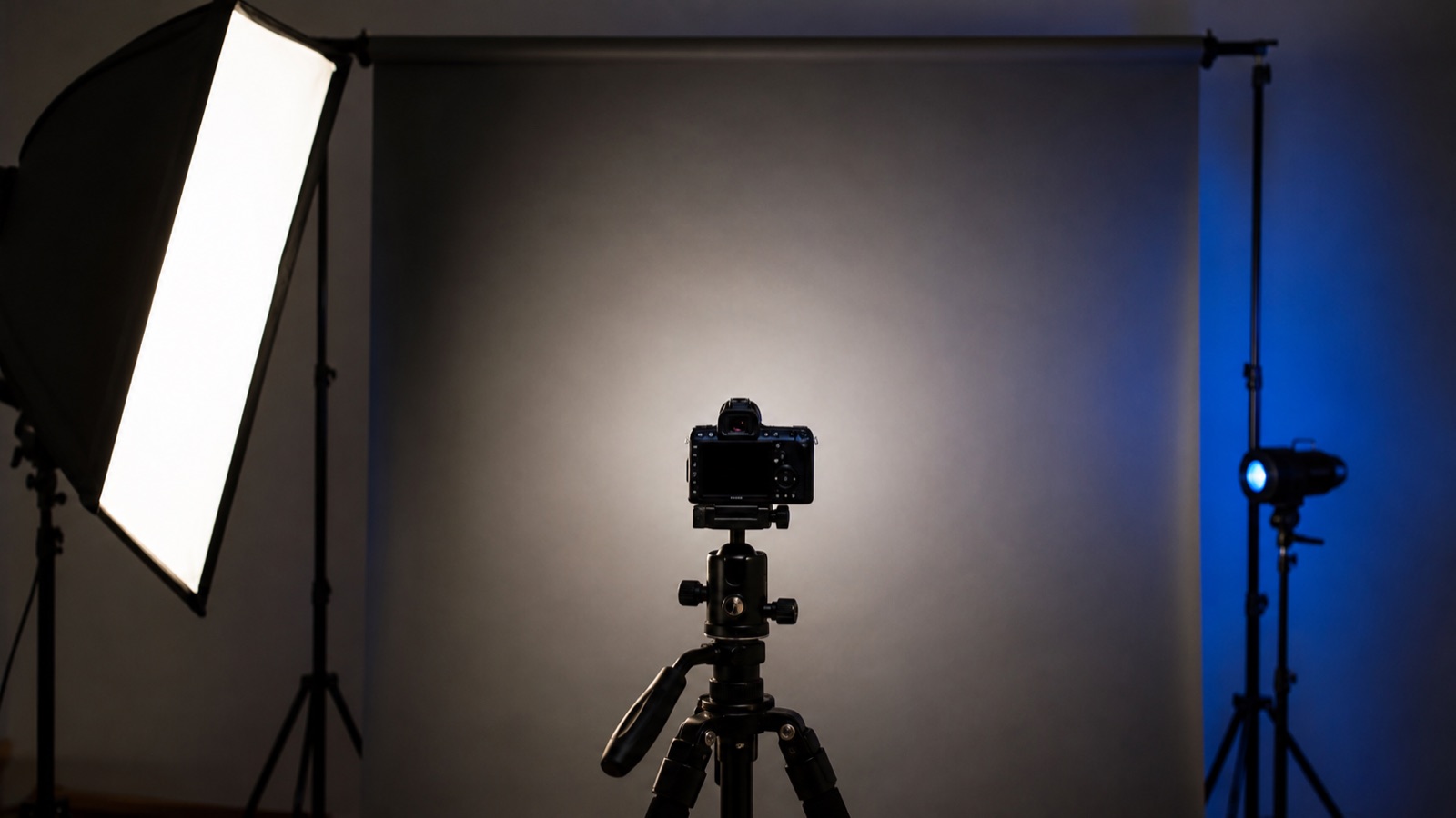 Editorial portrait lighting setup with a camera and a neutral background, representing a face rating game